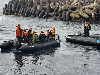 National Geographic Explorer passengers wave goodbye