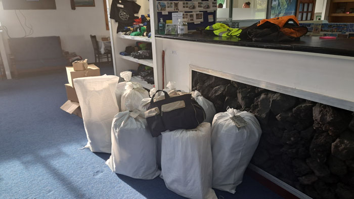 Bags and boxes of stamps and souvenirs ready to be taken on board the MS Ambience