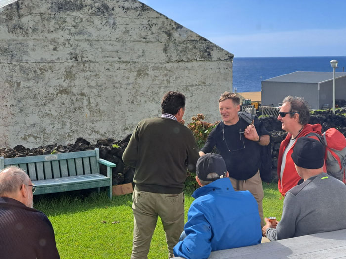 Acting Administrator, Michael Bertam greeting crew members in the Post Office & Tourism garden.