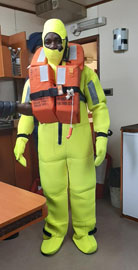 Crew member of the MFV Edinburgh demonstrating life saving gear