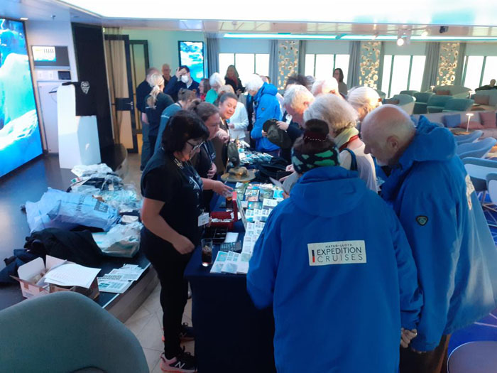 The stalls selling stamps, covers and Tristan handicrafts were popular. Passengers' postcards home will be in the next mail.