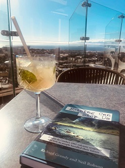 Preparatory reading on the quarantine hotel room balcony