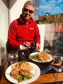 Jason Ivory enjoying one their creative meals on the quarantine hotel balcony