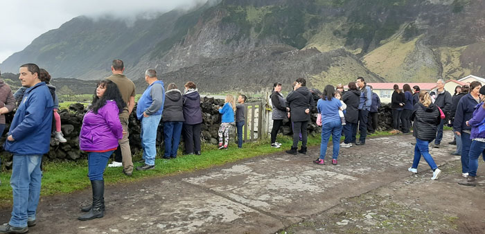 Islanders watching the helicopter ferry passengers between the Agulhas II and American Fence