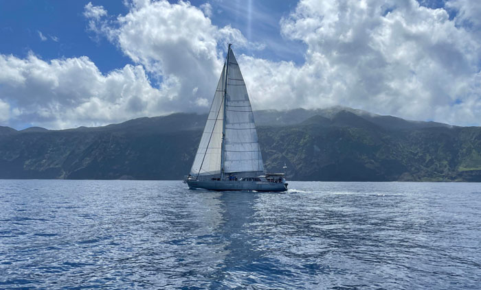 SV Urchin sailing off the coast of Tristan da Cunha