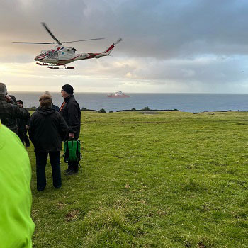 Helicopter ferrying passengers ashore