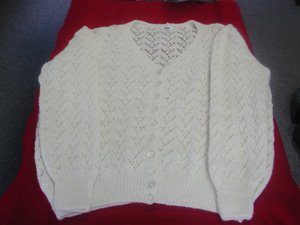 Cardigan in local white wool.